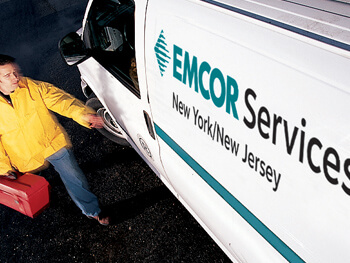 Technician walking towards a work van