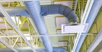 Ceiling view of an HVAC ventilation system at a commercial facility